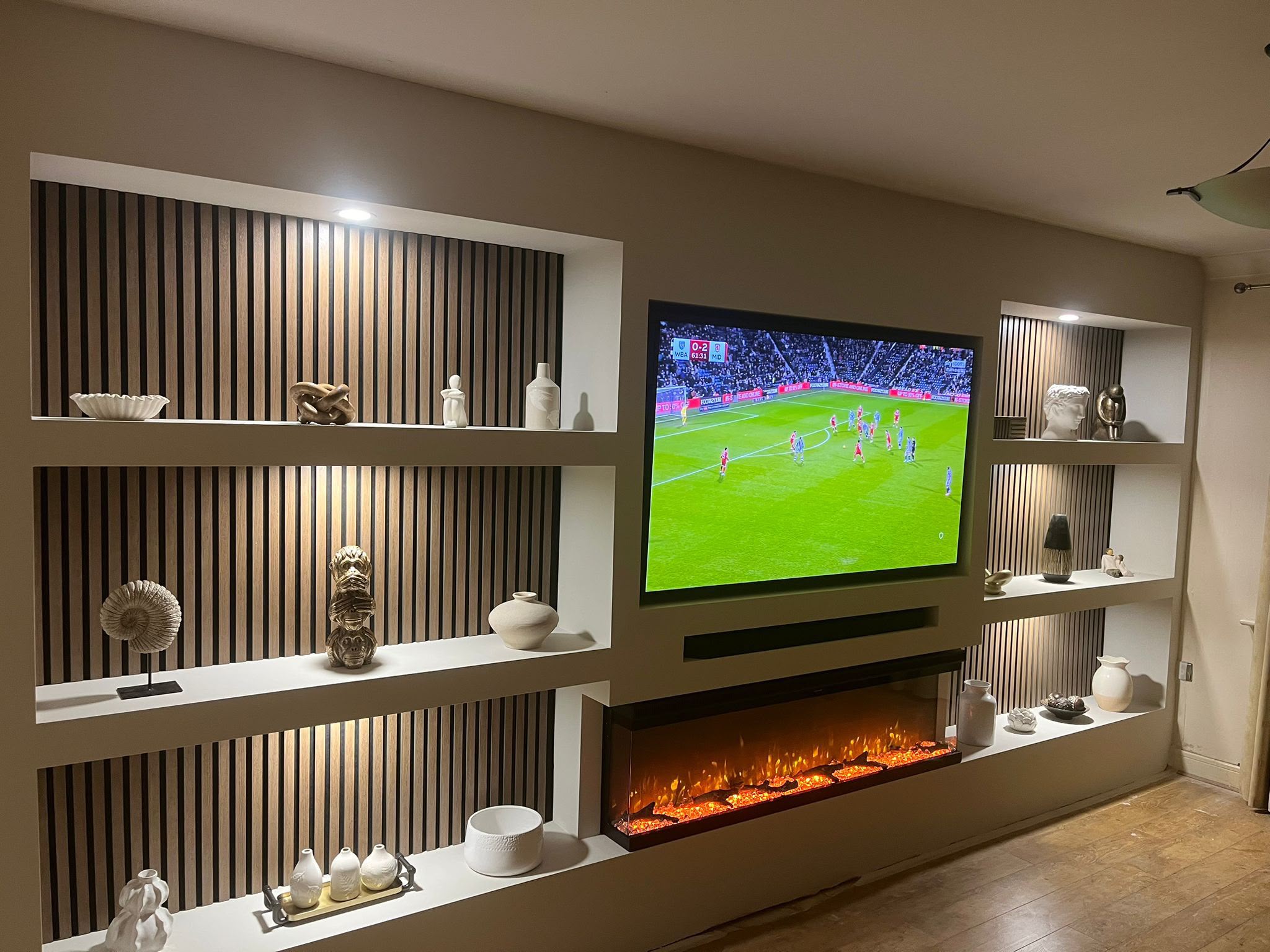 media wall features a strategically placed TV space